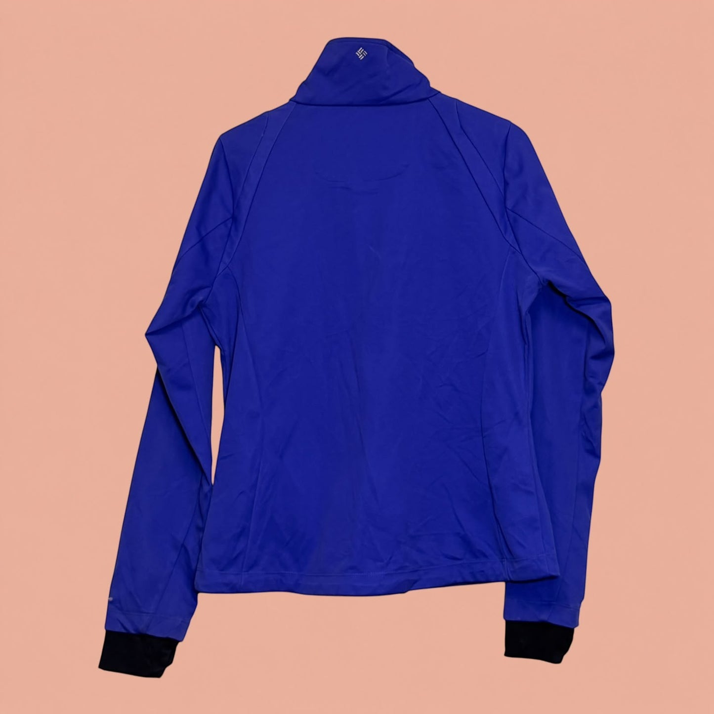 Chaqueta deportiva azul Columbia de segunda mano con cuello alto y puños negros de Tuclosetrenovado.cl