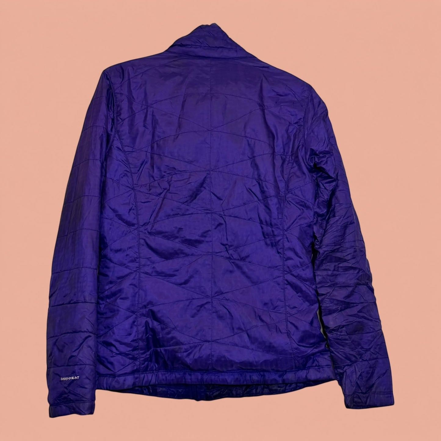 Chaqueta acolchada morada Columbia de Tuclosetrenovado.cl con tecnología Omni-Heat, vista trasera
