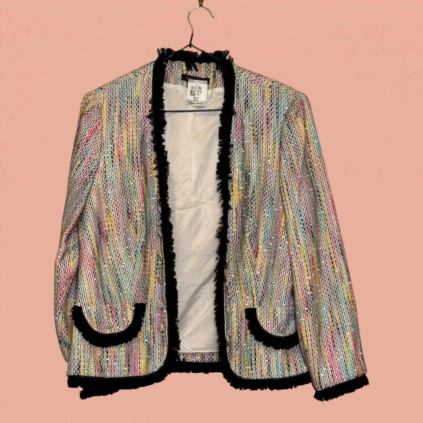 Blazer de segunda mano Tuclosetrenovado.cl con tejido multicolor tipo tweed, ribetes negros y bolsillos frontales.