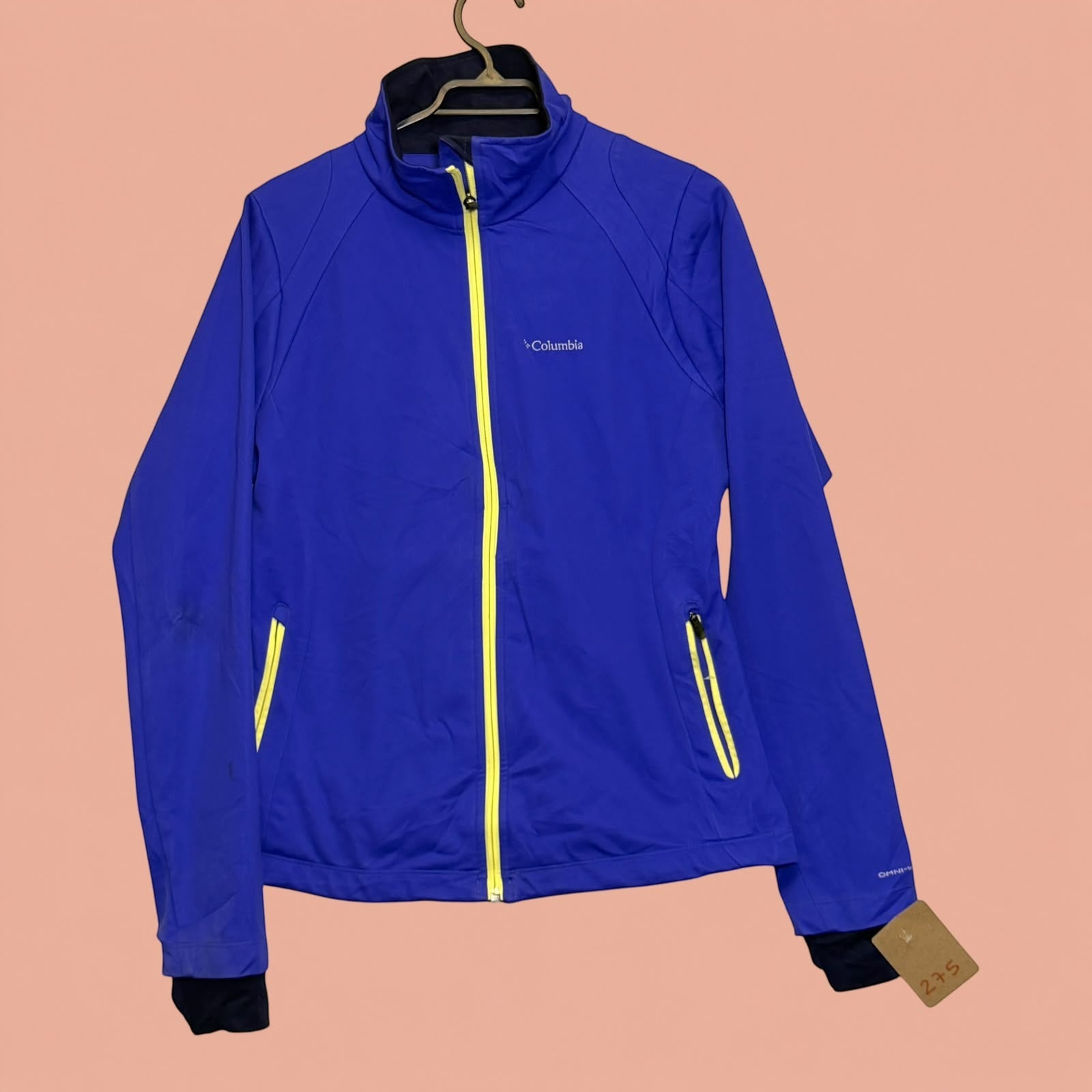 Chaqueta deportiva Columbia de Tuclosetrenovado.cl en color azul con cremallera frontal y detalles en amarillo neón