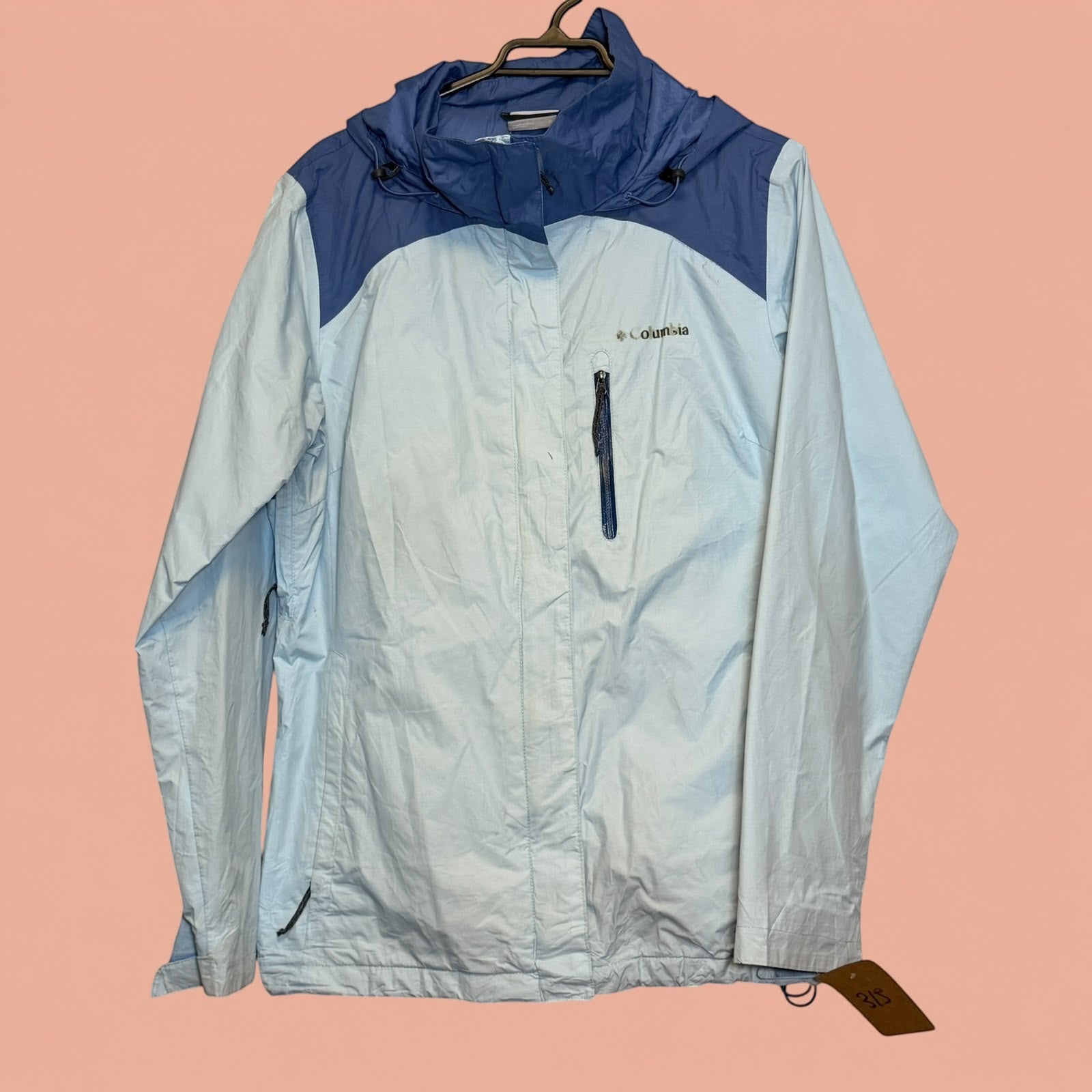 Chaqueta impermeable Columbia de segunda mano en Tuclosetrenovado.cl, color azul claro y oscuro con capucha