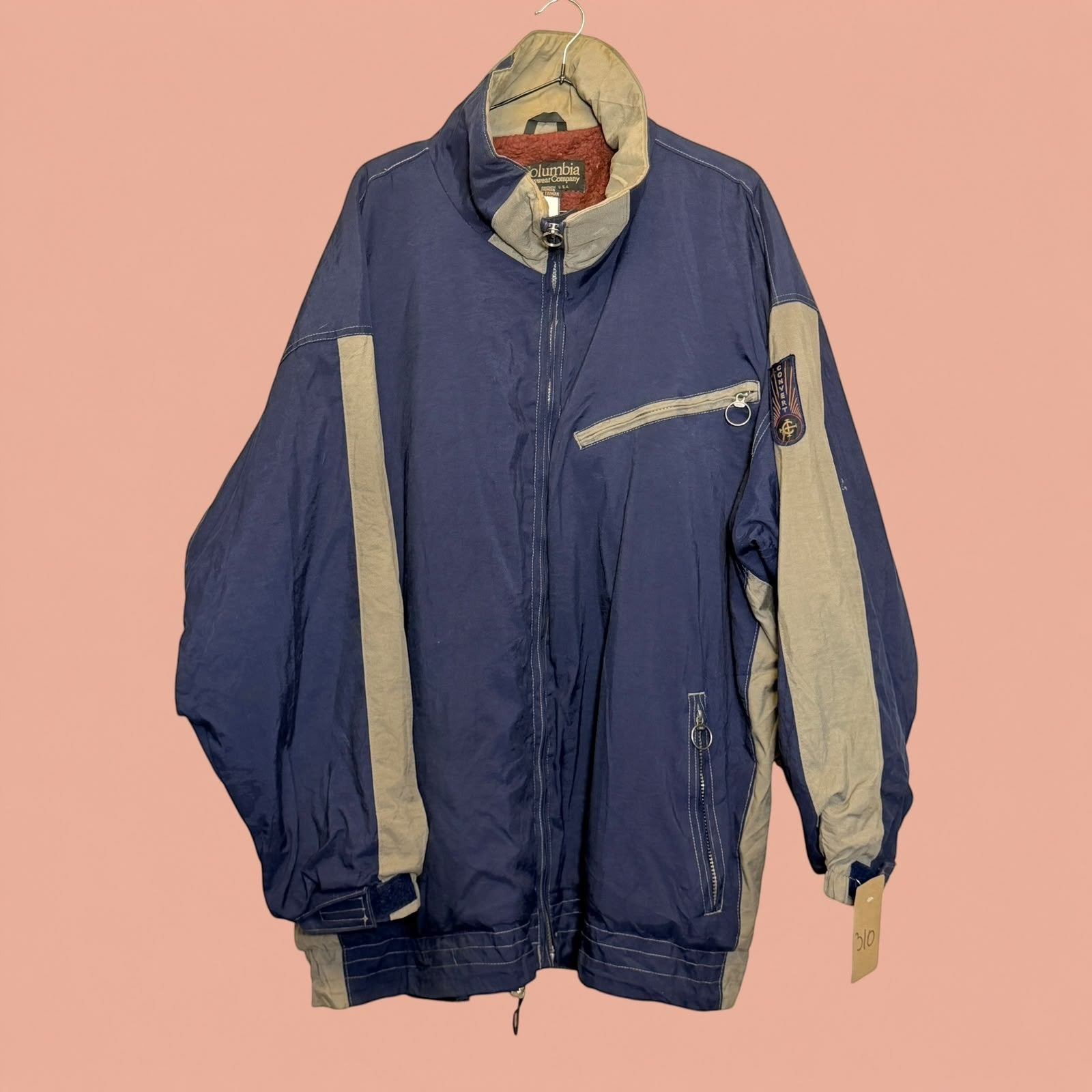 Chaqueta Columbia de hombre azul y beige con cremallera y forro interior, disponible en Tuclosetrenovado.cl