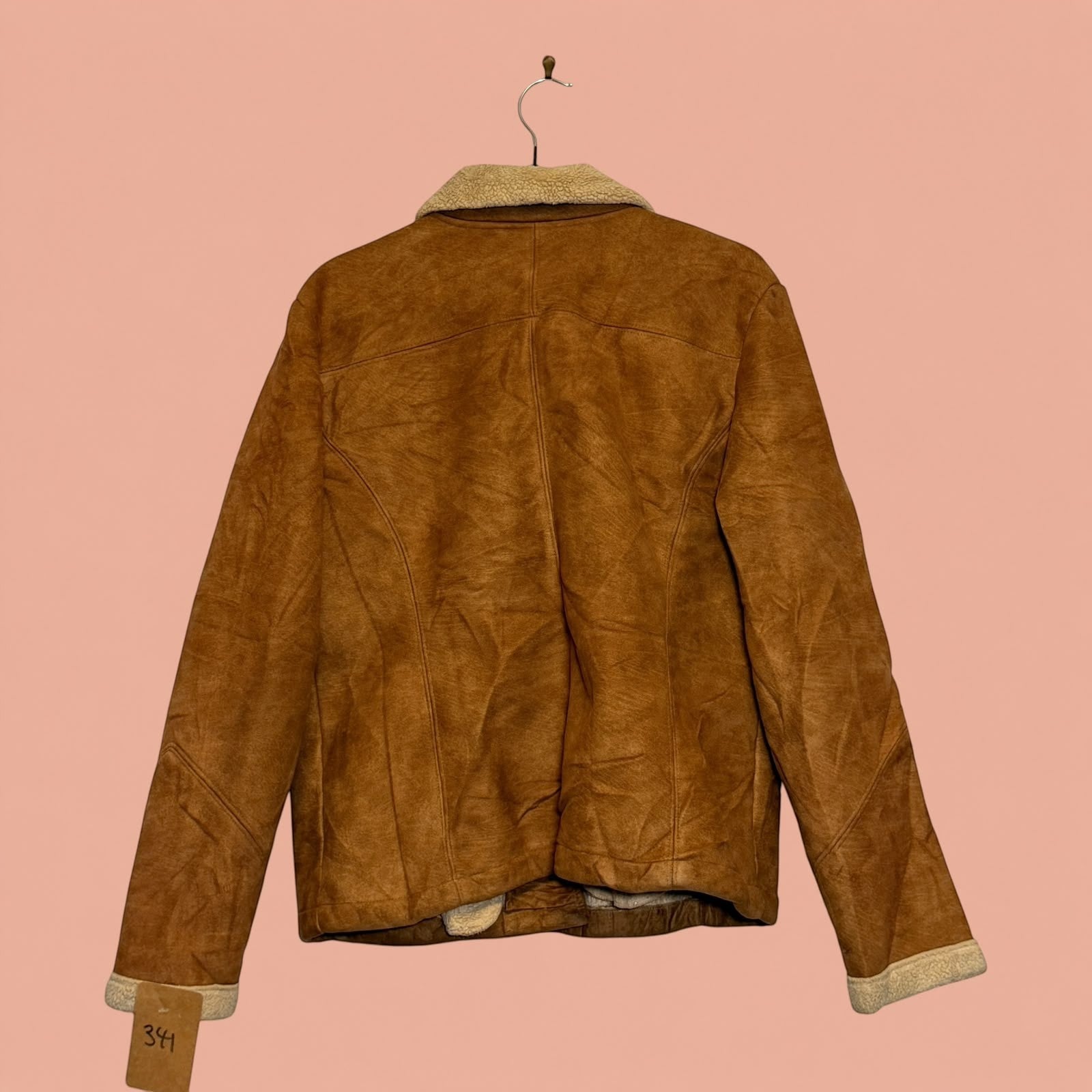 Chaqueta gamulan de segunda mano Tuclosetrenovado.cl color café con forro de chiporro vista trasera