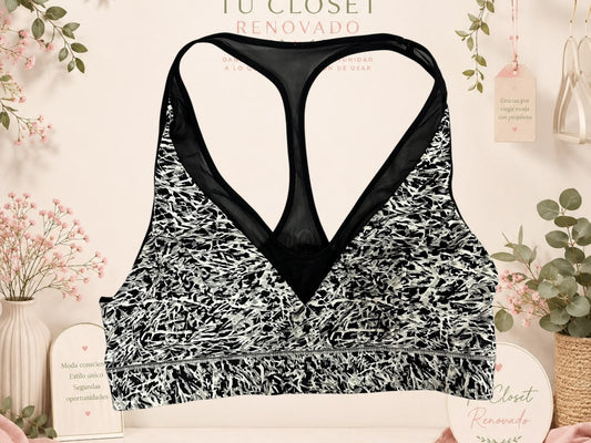 Sujetador deportivo Tuclosetrenovado.cl con estampado abstracto en blanco y negro y espalda de nadador en malla negra