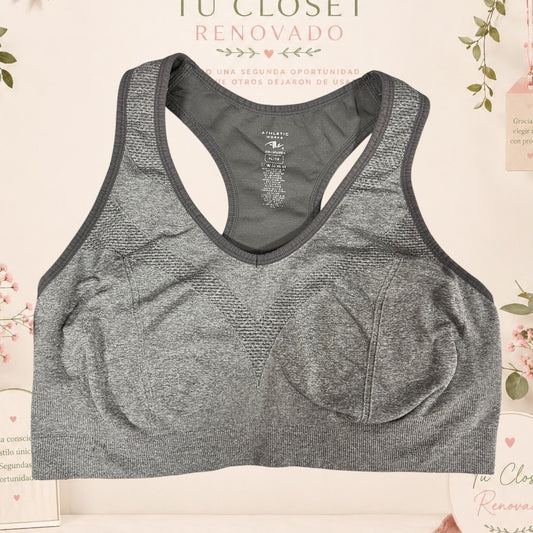 Sujetador deportivo gris de Tuclosetrenovado.cl con diseño de espalda nadadora y tejido transpirable sin costuras