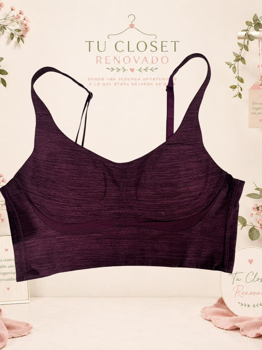 Sujetador deportivo Tuclosetrenovado.cl de color morado oscuro con textura jaspeada y tirantes ajustables