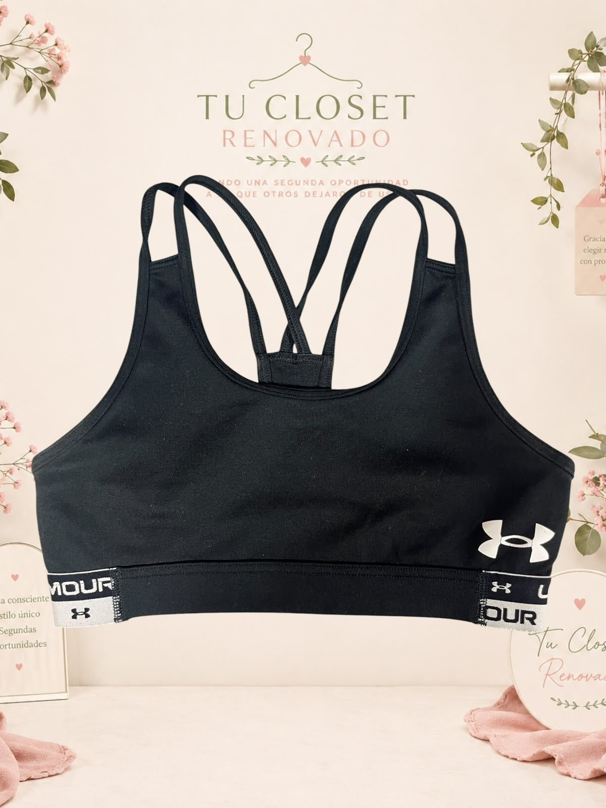 Top deportivo negro Under Armour con tirantes cruzados en la espalda, disponible en Tuclosetrenovado.cl