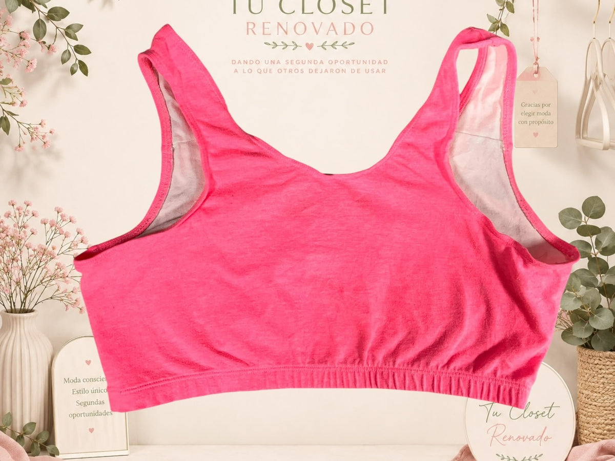Top deportivo rosa de Tuclosetrenovado.cl con diseño de espalda nadadora y banda elástica inferior